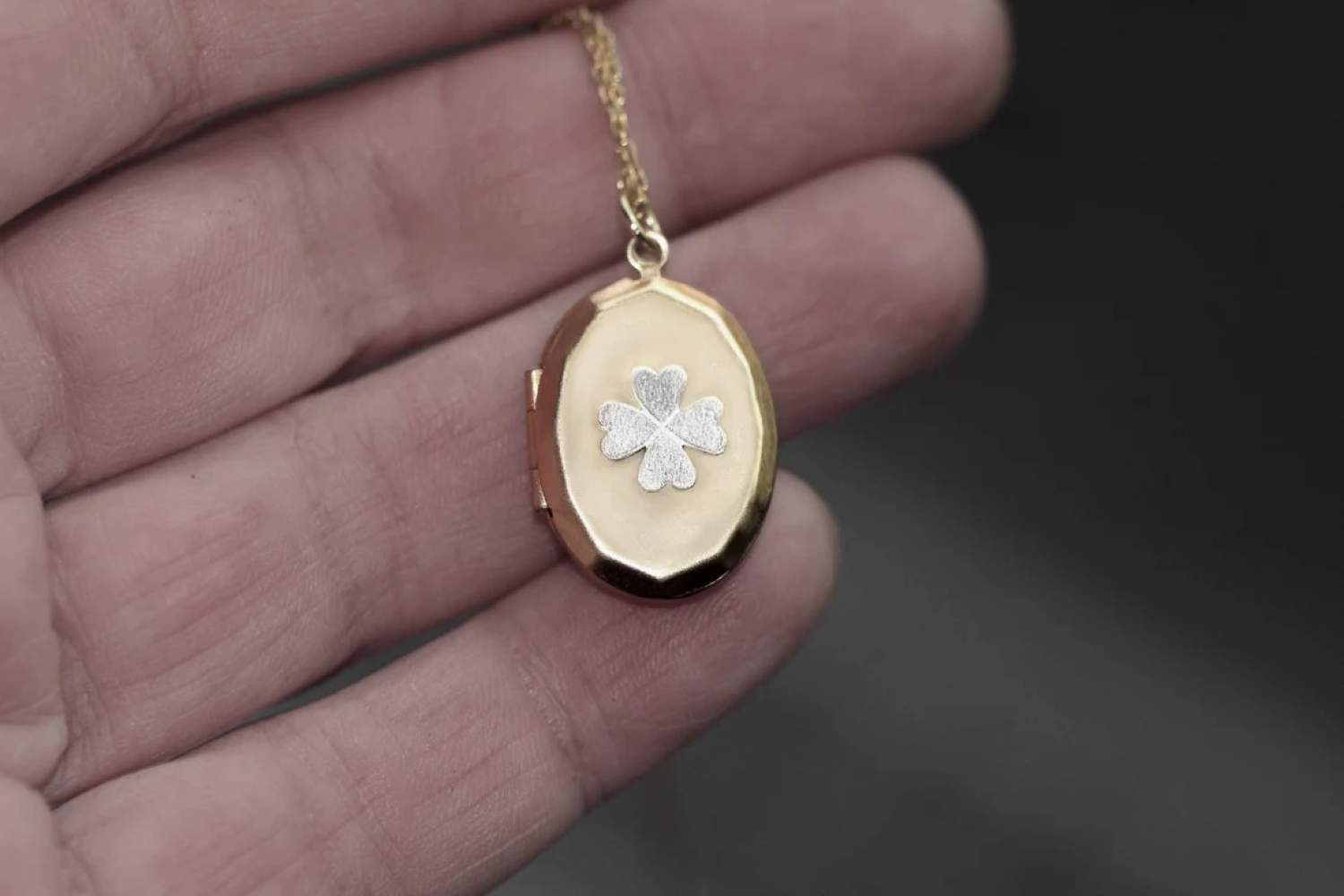 Four leaf clover locket necklace. Silver clover on vintage pendant